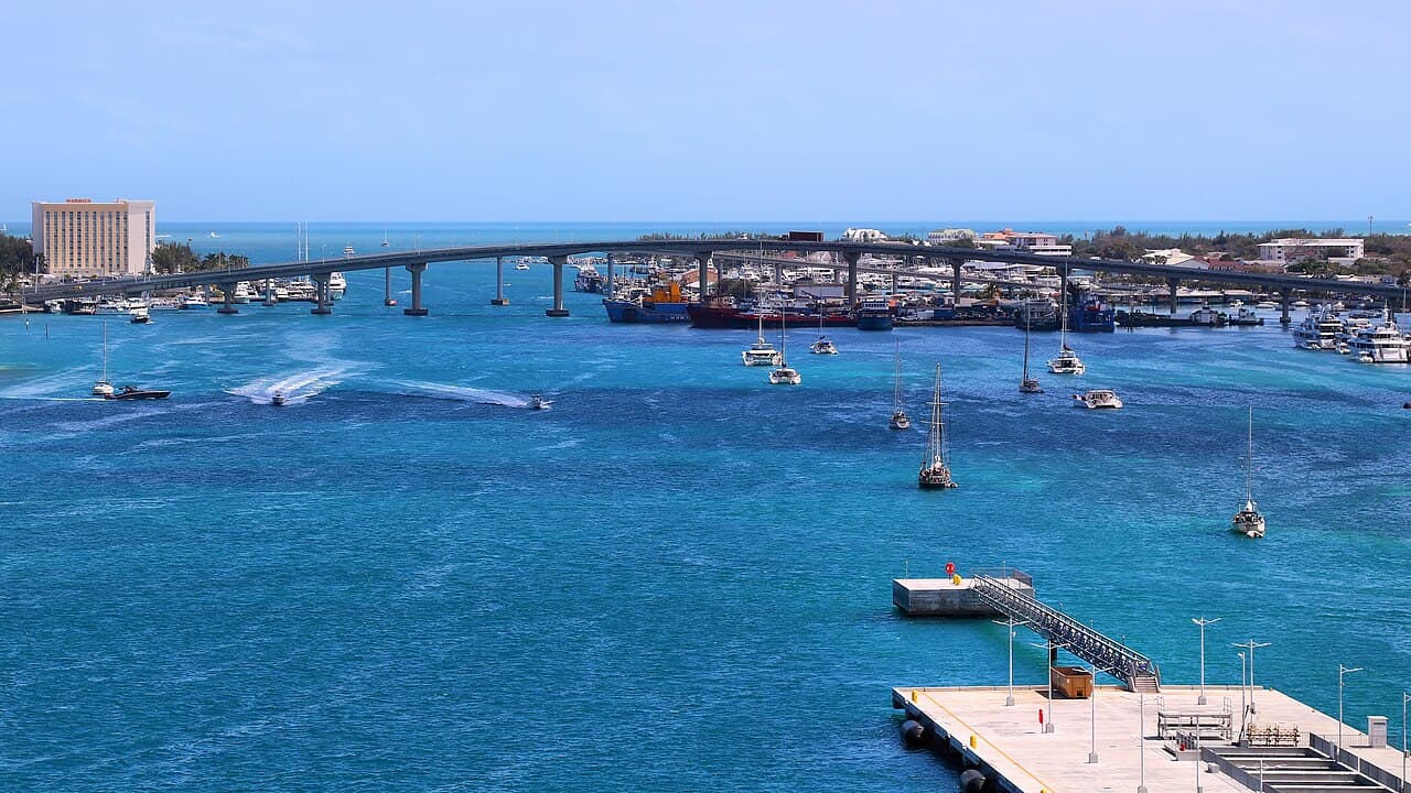 Boats on the bright blue water of Nassau Harbor.